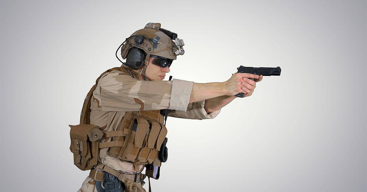 Soldier with tactical vest and gun