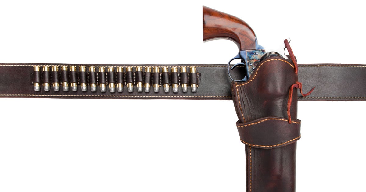 Gun in holster with bullet belt