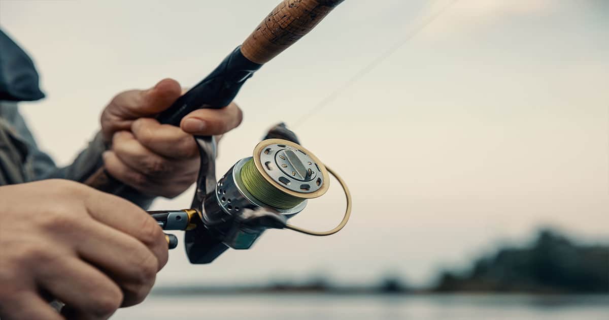 Man reeling in fish