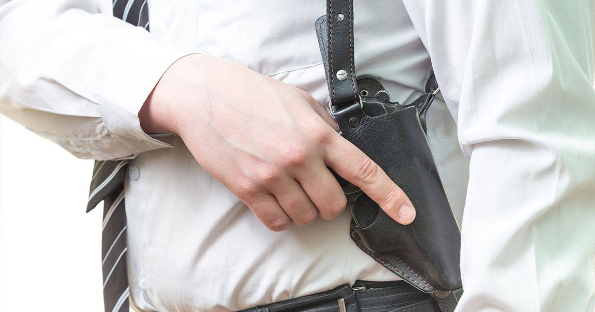 Man in suit wearing holster