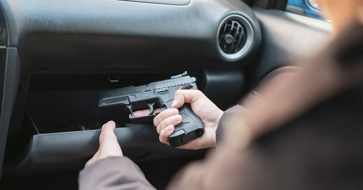 Taking gun out of glove compartment