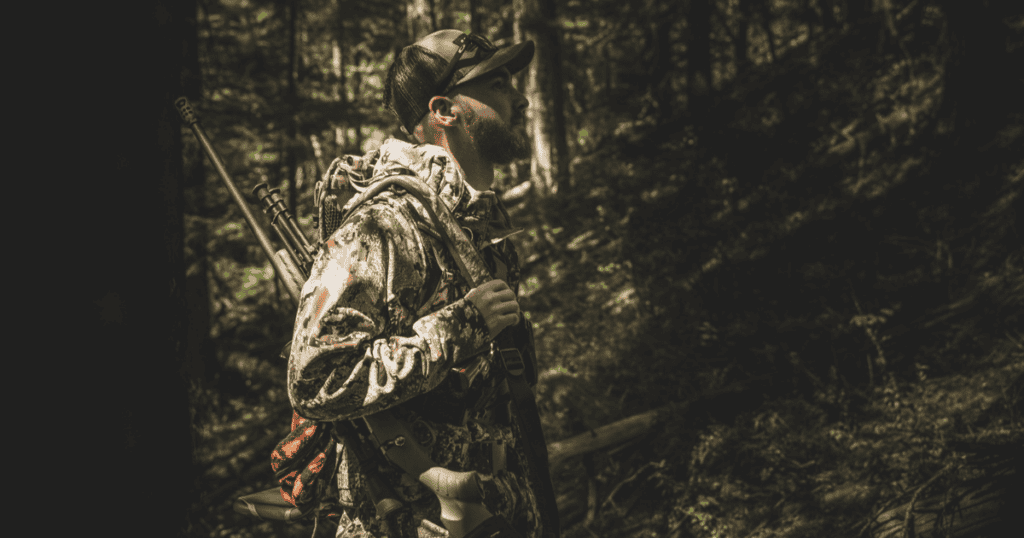 A hunter out hunting bear carrying Warning Shot by GunfightersINC.