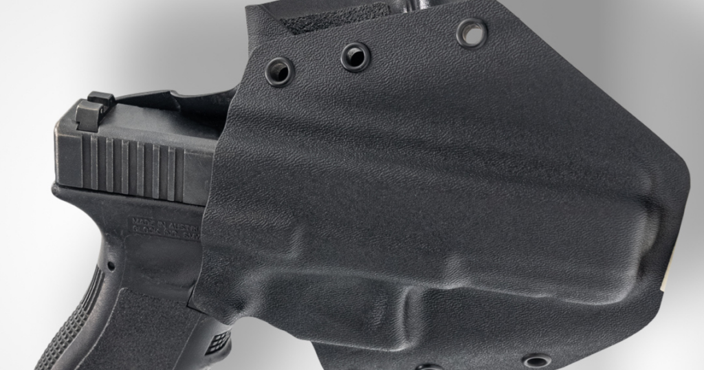 The GunfightersINC Ronin OWB Holster in black against a white background.