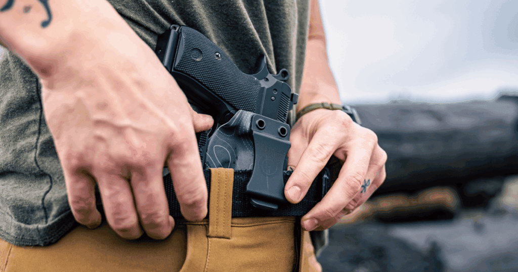 A man using his GunfightersINC Wraith IWB Holster.