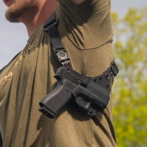 Man raising arm with a Spectre Lite containing a G43.