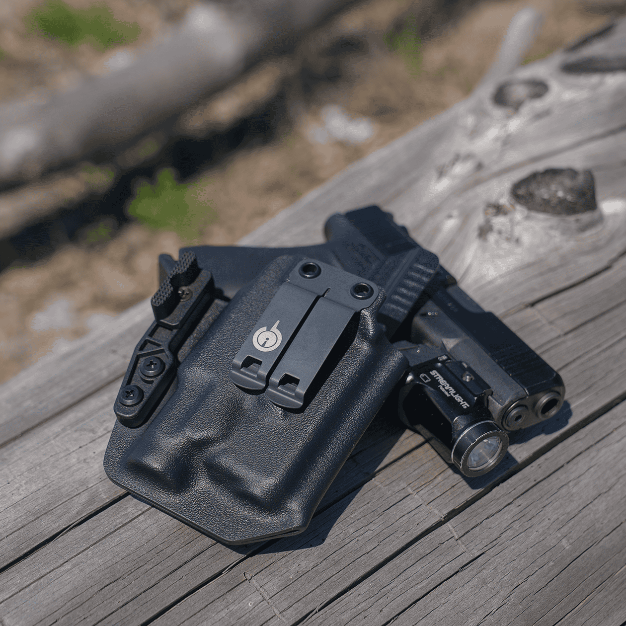 Ready to Ship Light Bearing Wraith Resting on Pistol on Log