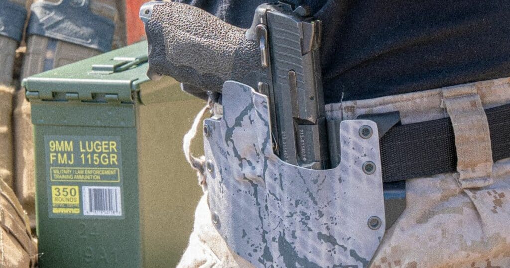 A man wearing the GunfightersINC Ronin OWB Holster on his hip while fishing.