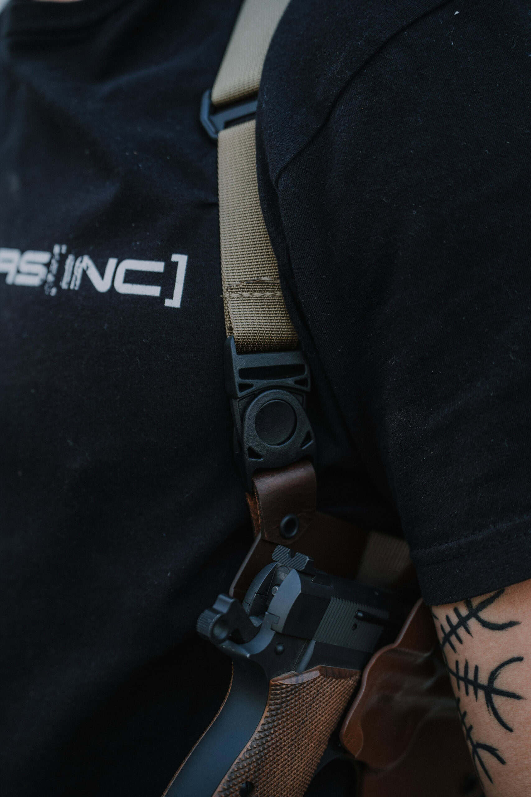 A focus on the leather knuckle and connection for the Spectre Shoulder Holster.