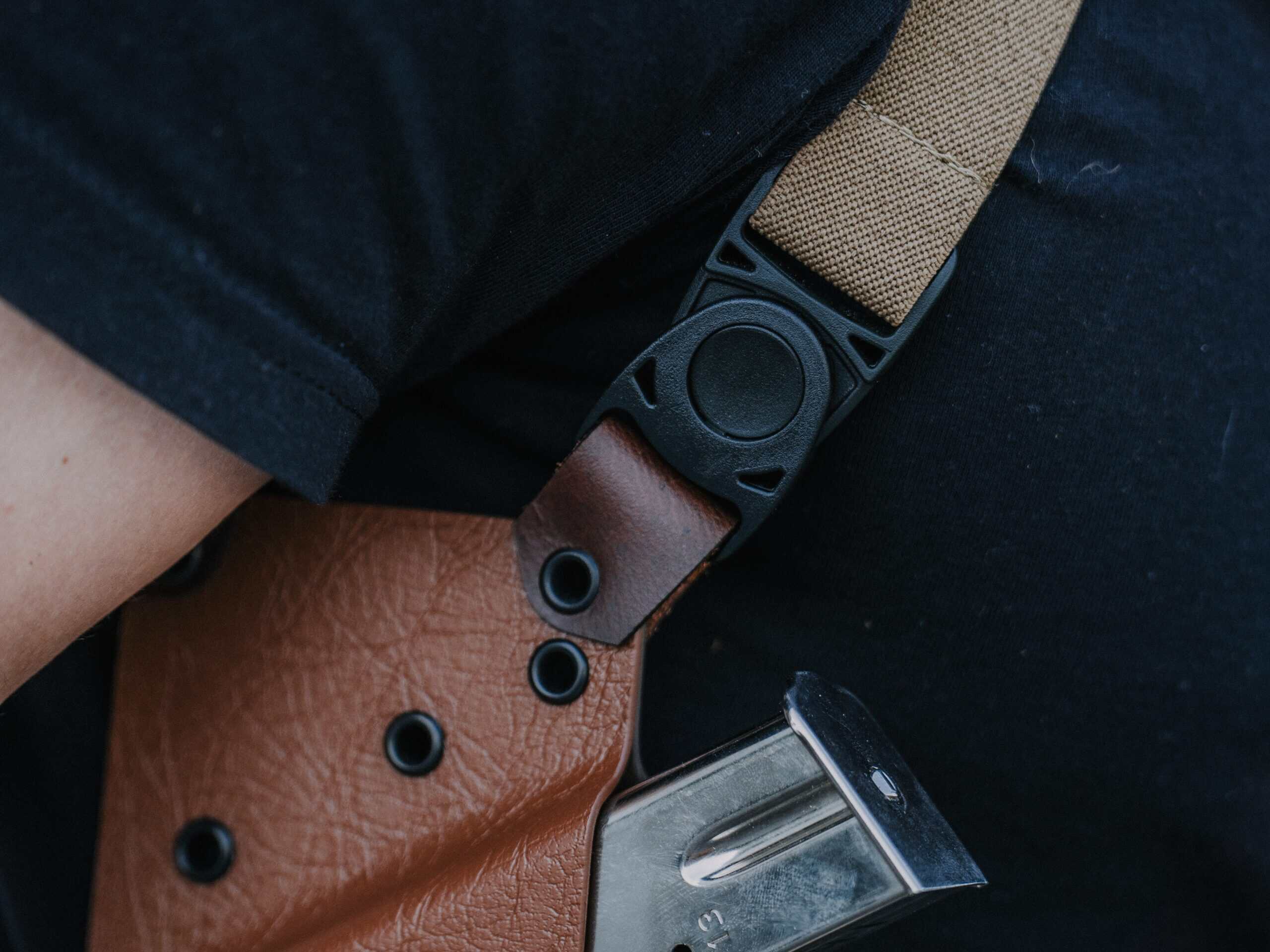 a man wearing a spectre deluxe with a focus on the leather knuckle